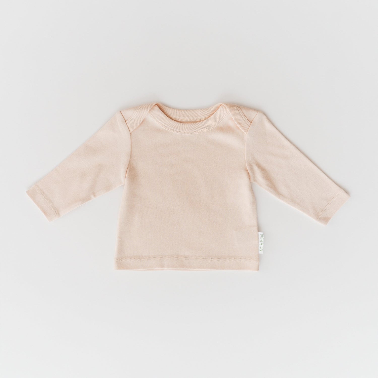 Rosy peach long sleeve baby shirt with an envelope neckline
