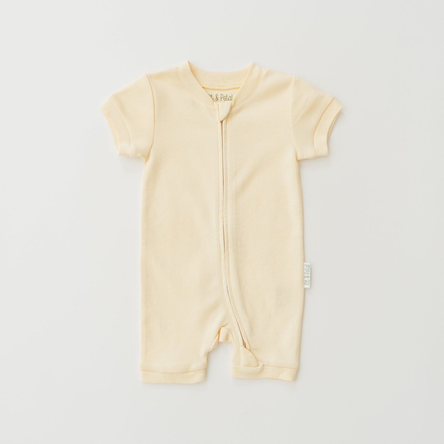 Short sleeve baby romper in sunny yellow with a front zipper.