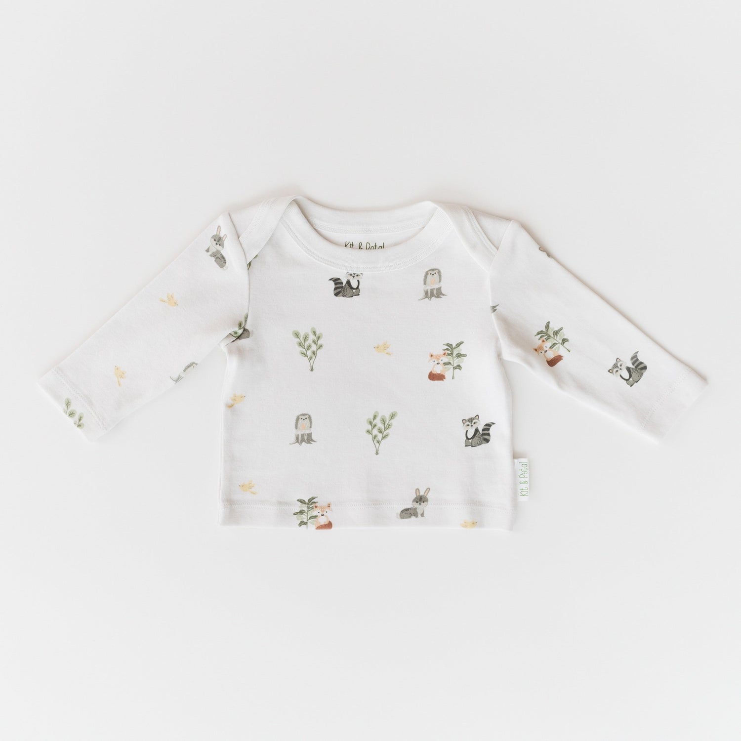 Long sleeve baby shirt with forest animal and nature print and an envelope neckline.