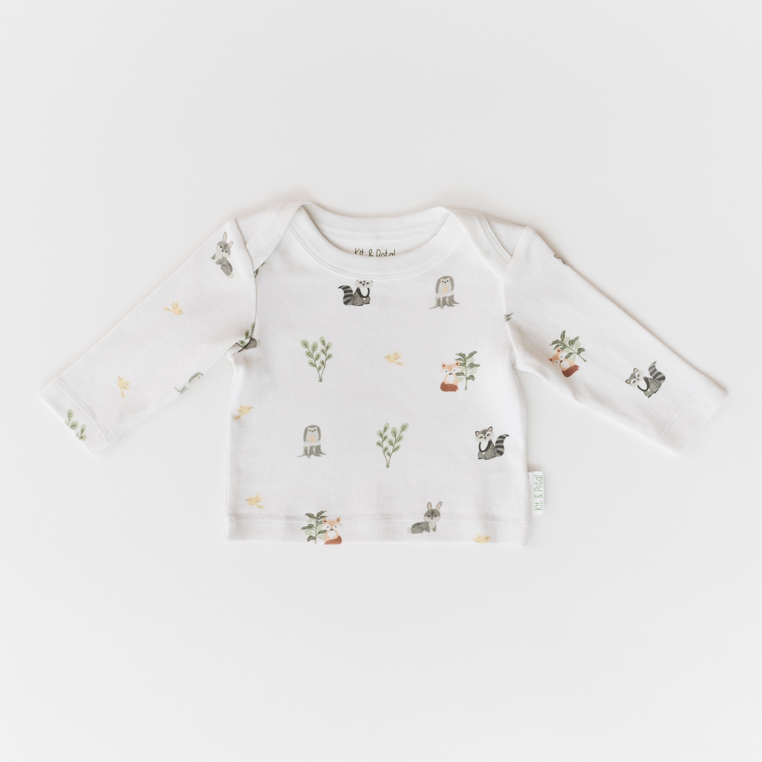 Long sleeve baby shirt with forest animal and nature print and an envelope neckline.