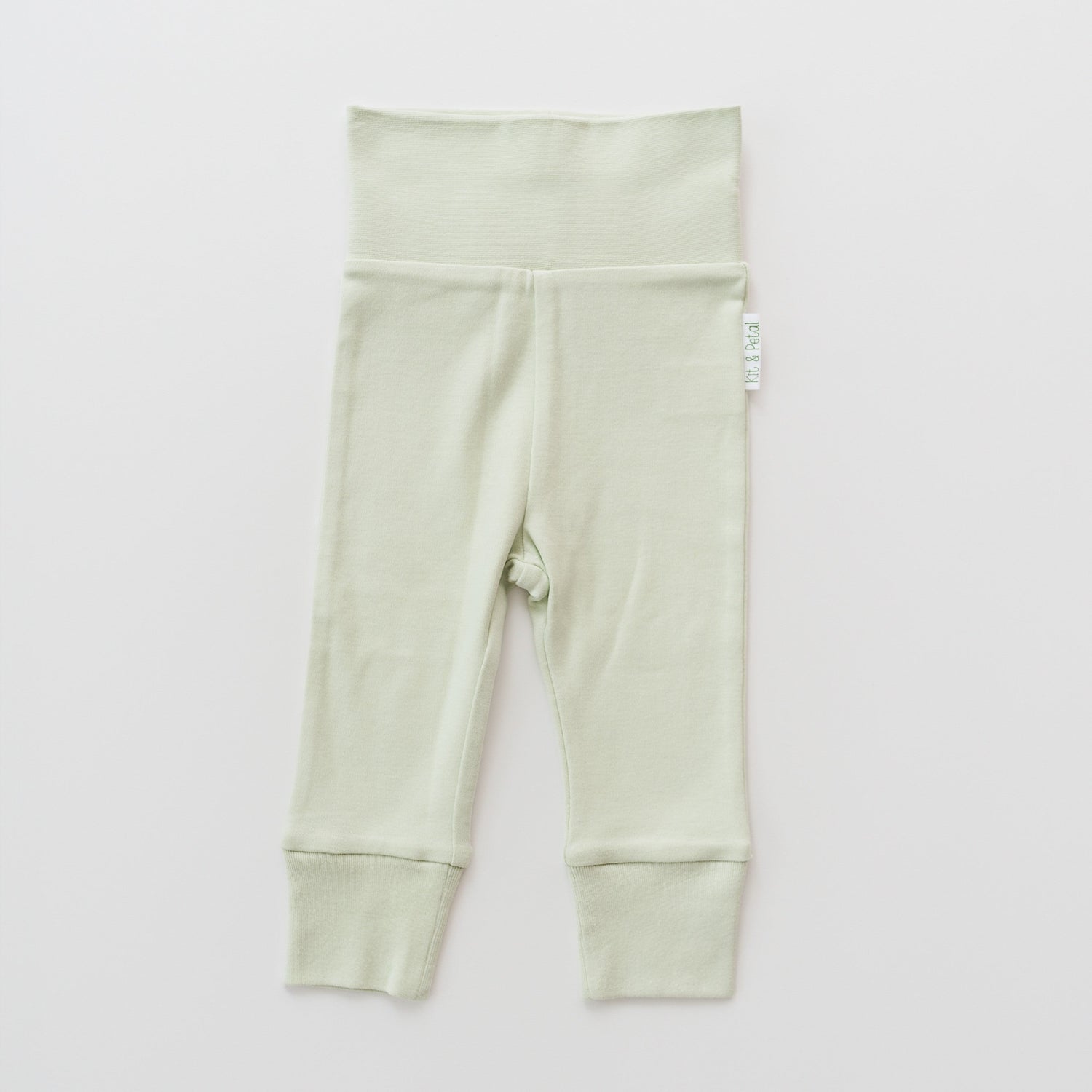 Fold-over baby pants in leafy green with a wide folded waistband