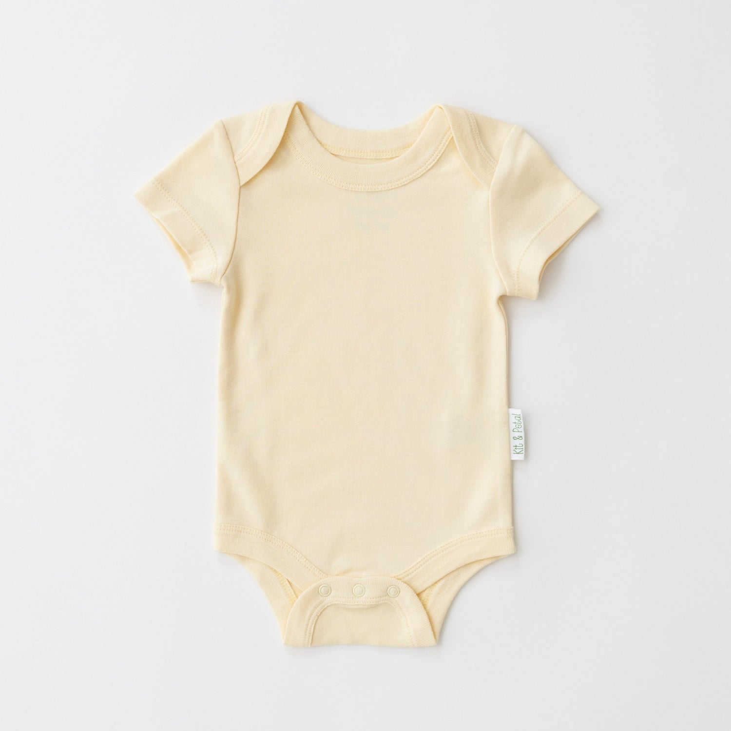 Short sleeve baby bodysuit in sunny yellow with envelope neckline and snap buttons