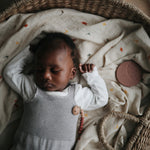 Soft Mushie organic cotton muslin baby swaddle blanket.
