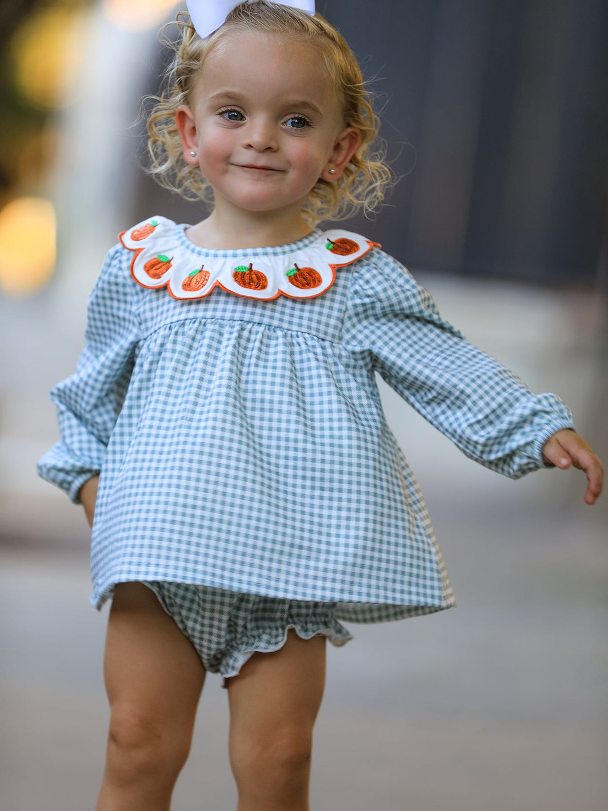 Two-piece girls bloomer set with pumpkin embroidery on the top, shown with matching bloomer shorts