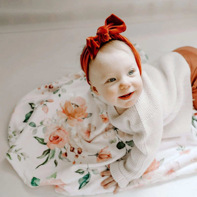 Premium baby and toddler blanket with peach floral design, soft polyester fabric, 30x40 inches.