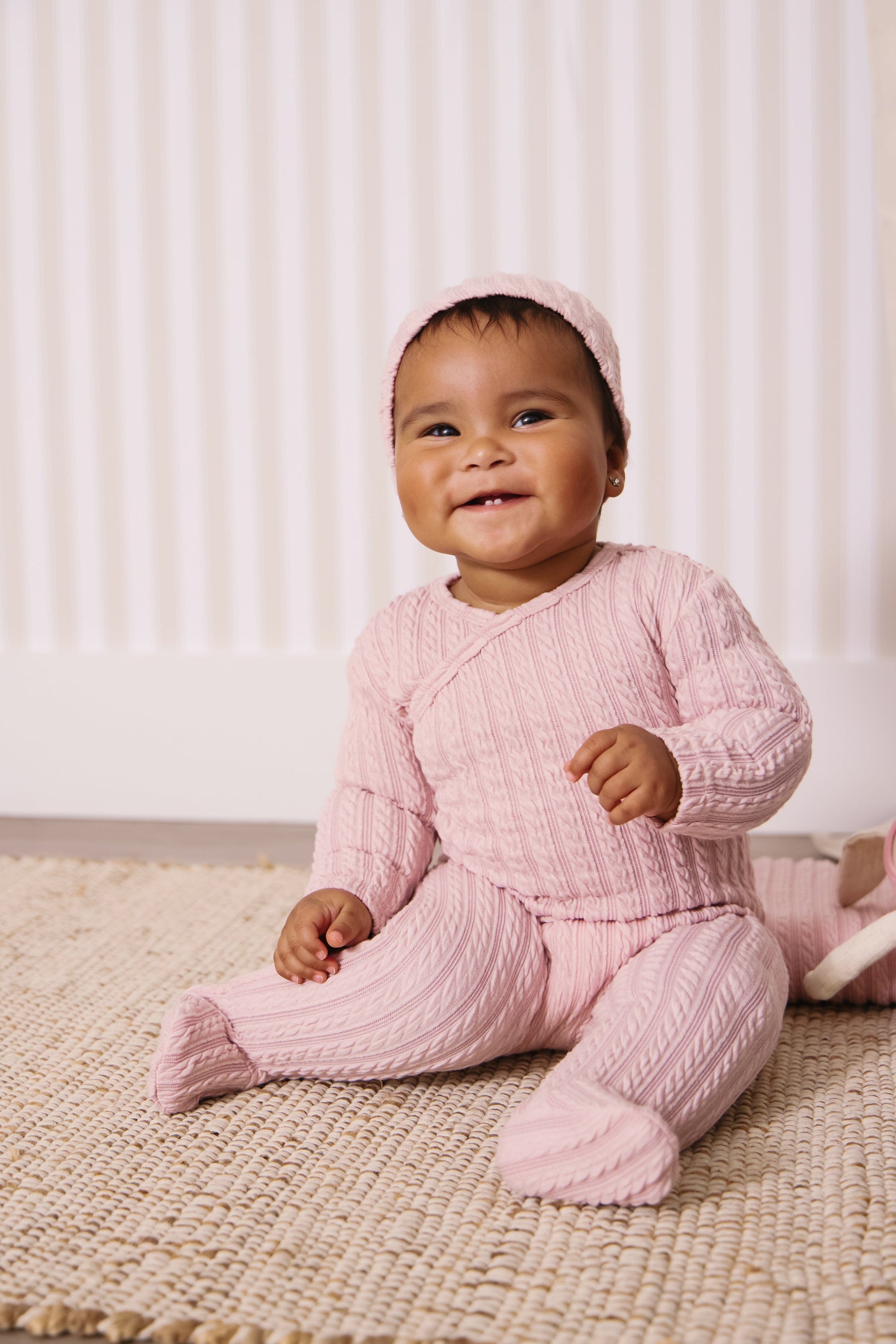 KIPP Collection Cable Knit Baby Footie With Wrap Detail And Hat For Newborns by KIPP™ Collection at Everetts Place