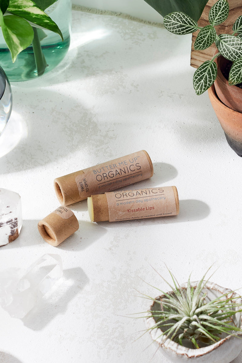 Kissable Lips chapstick lip balm in eco-friendly paperboard tube on a white surface.