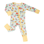 LollyBanks Little Barnyard organic baby zipper pajama with farm animal print on a white background