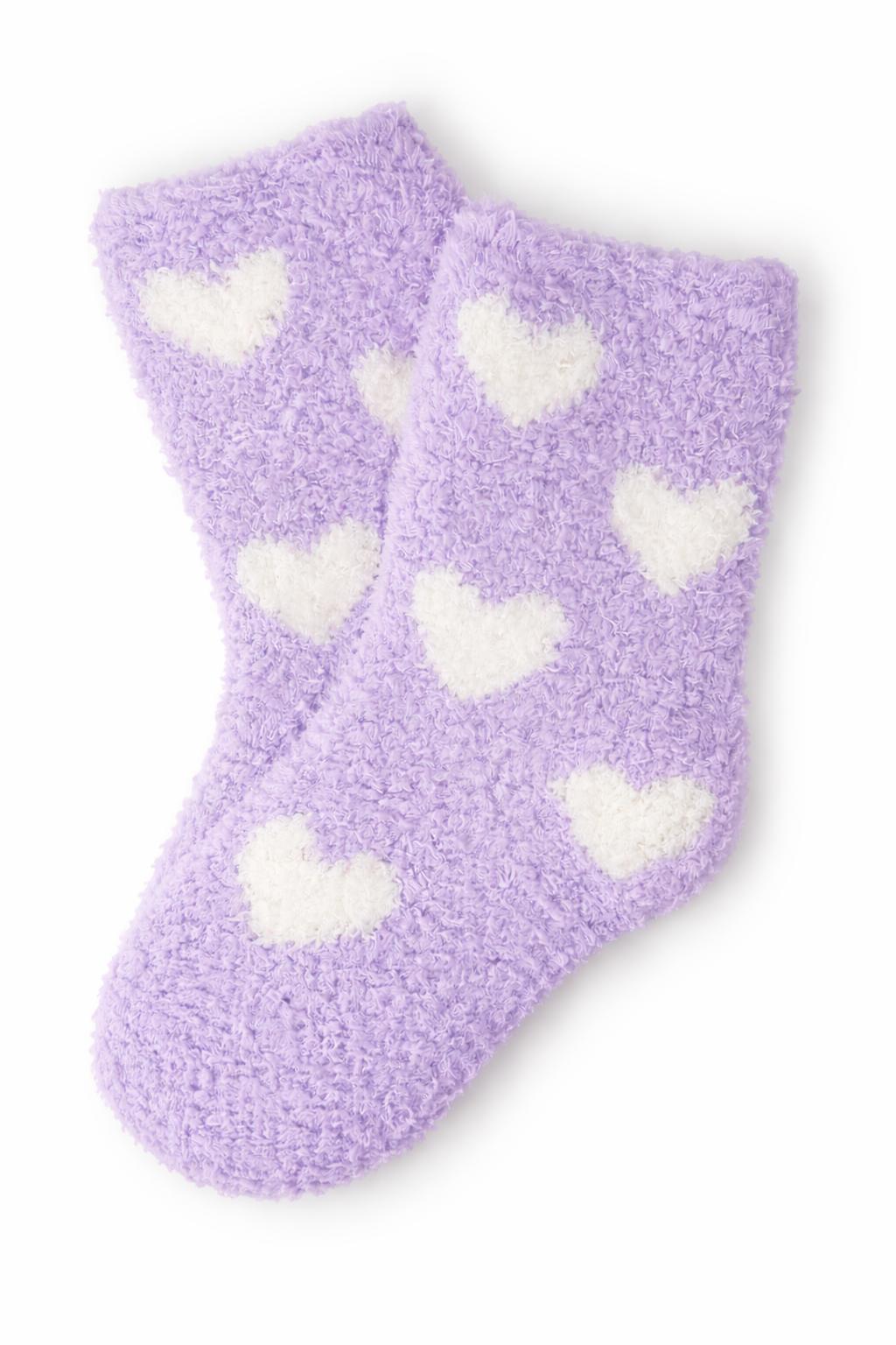Pair of lavender and coconut cozy socks with a heart pattern for little feet