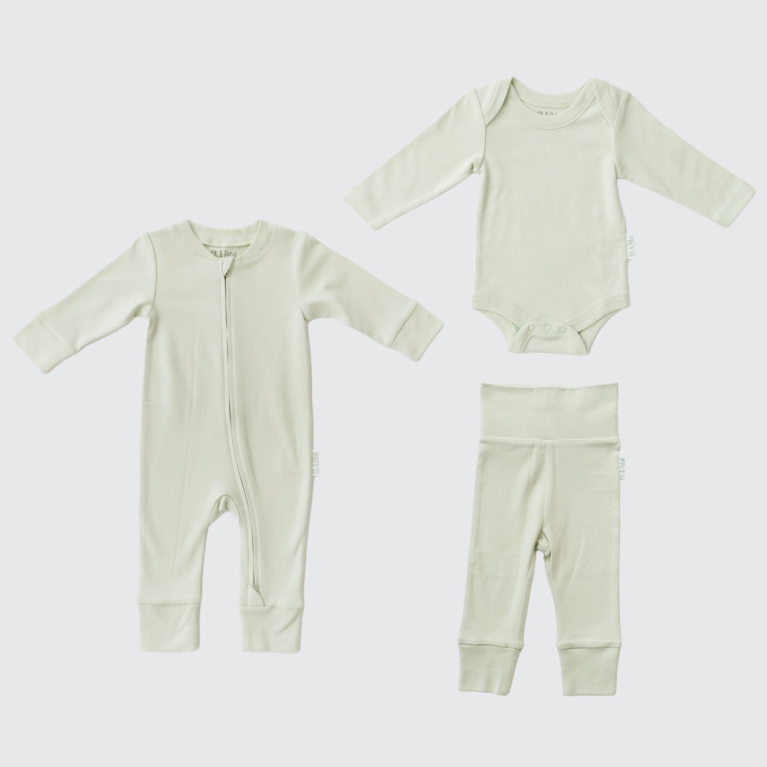 Three-piece baby outfit set in leafy green: long sleeve romper, bodysuit, and fold-over pants