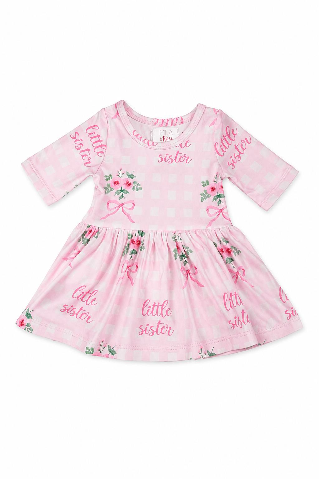 Baby girl twirl bodysuit with floral print, 3/4 sleeves, attached twirl skirt, and snap closure at the bottom.
