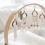 Modern Nursery natural wood baby play gym, organic hanging toys.