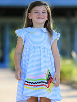 Girls dress with colorful crayon print and a pink ruffle petal collar with applique detail
