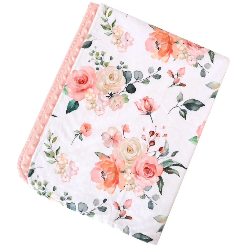 Premium baby and toddler blanket with peach floral pattern and soft minky dot texture.