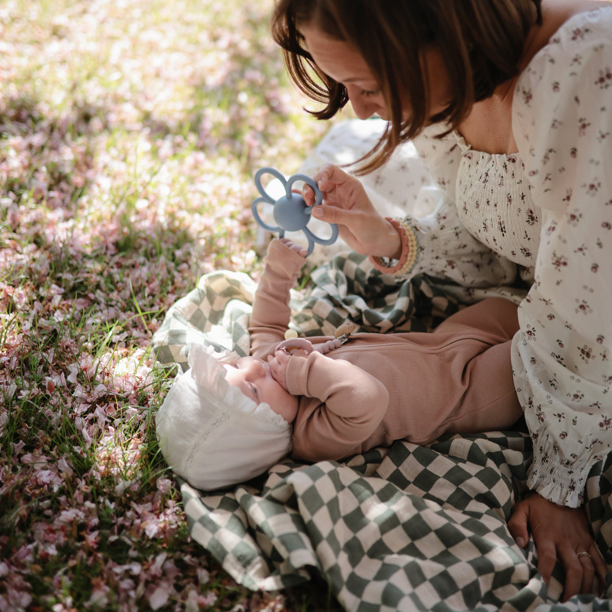 Mushie Daisy Rattle Teether, organic baby toy for teething and sensory play.