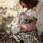 Mushie Daisy Rattle Teether, organic baby toy for teething and sensory play.
