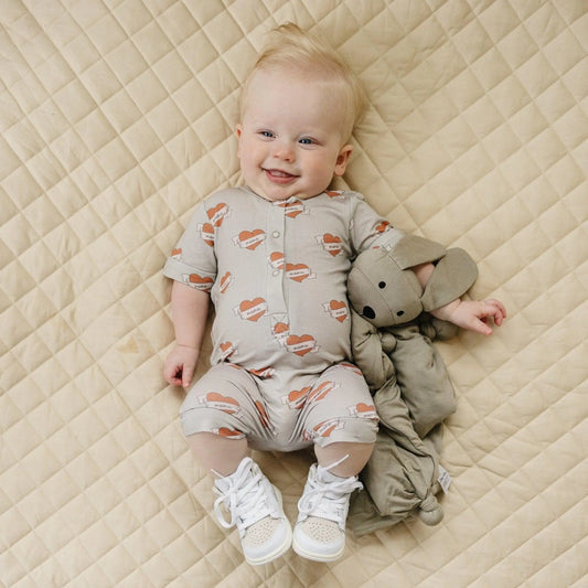 Little Joy Co. Mama Tattoo Hearts Bamboo Henley Romper for Babies - Apparel & Accessories > Clothing > Baby & Toddler Clothing > Baby One-Pieces