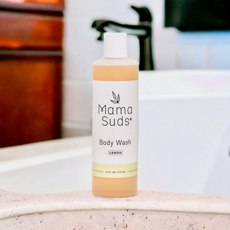 MamaSuds Body Wash Soap bottle on bathroom counter near sink.