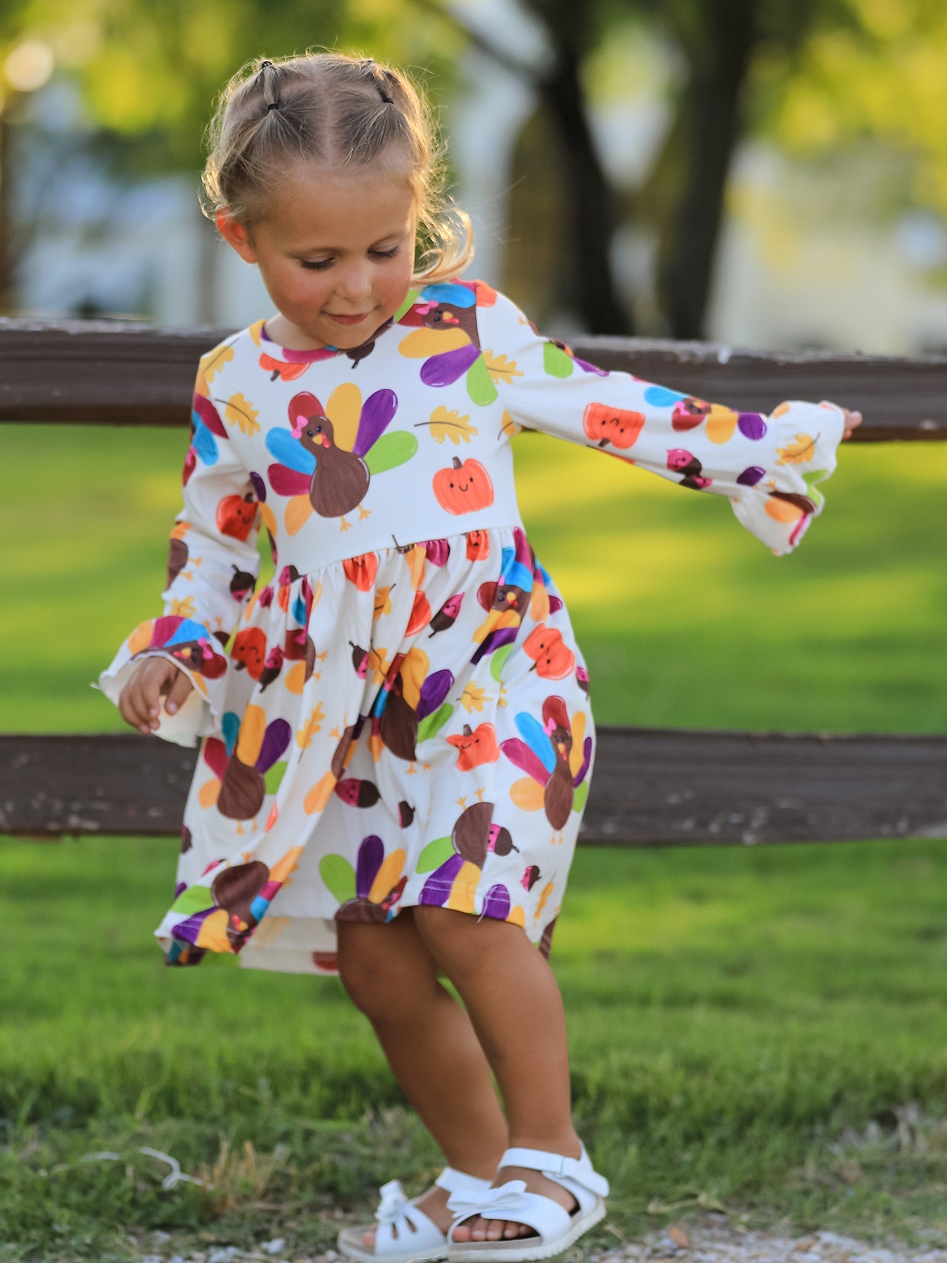 Girls dress with an allover Thanksgiving turkey print