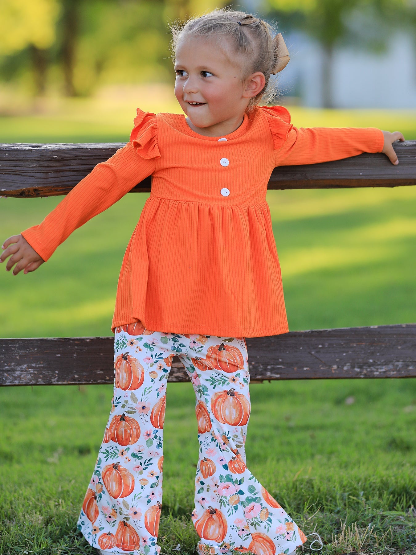 Girls two-piece set with pumpkin print top and matching bottoms