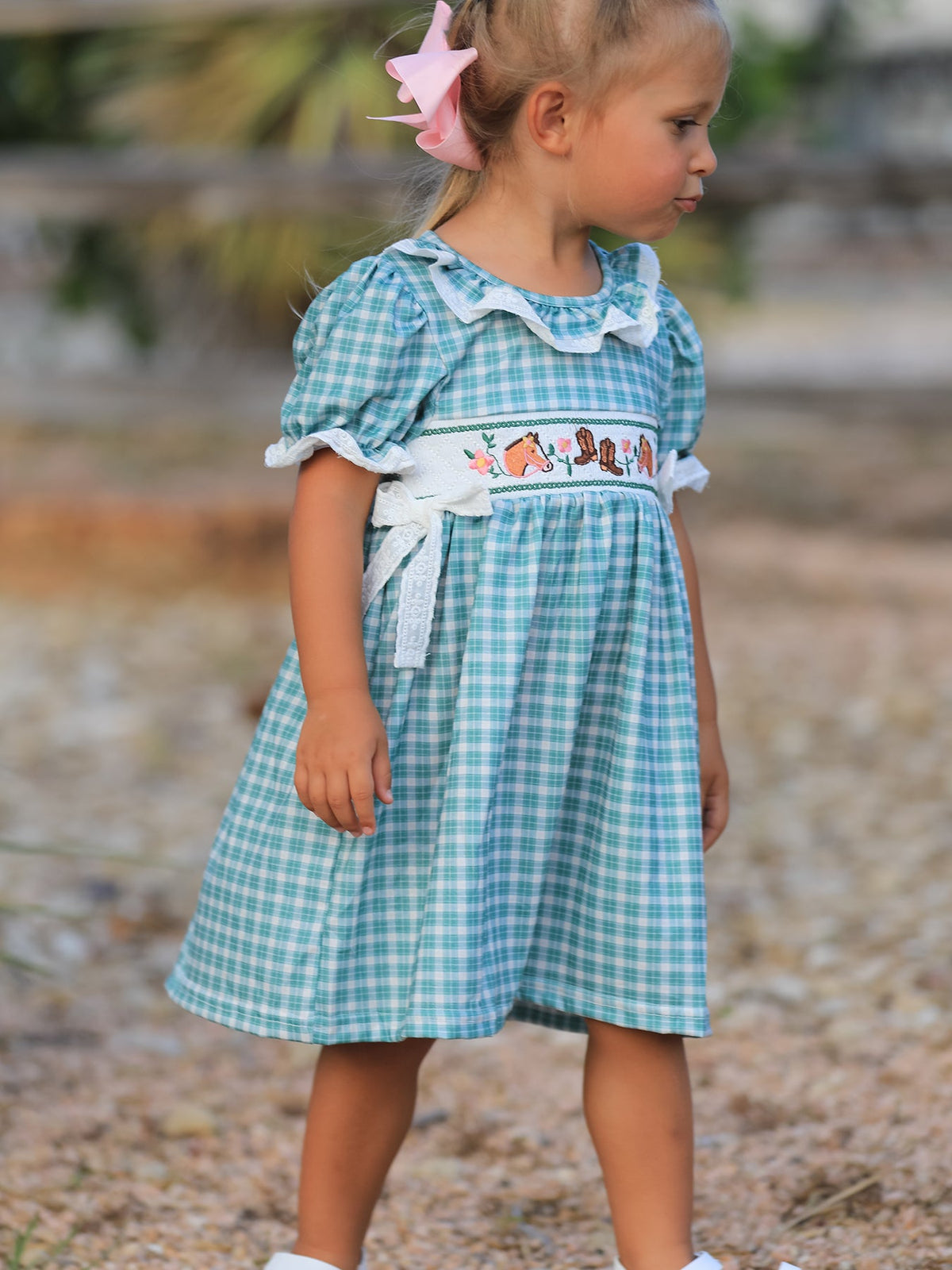 Mint plaid girl dress with horse and cowboy boot embroidery, puff sleeves, lace ruffle trim, and bow accents