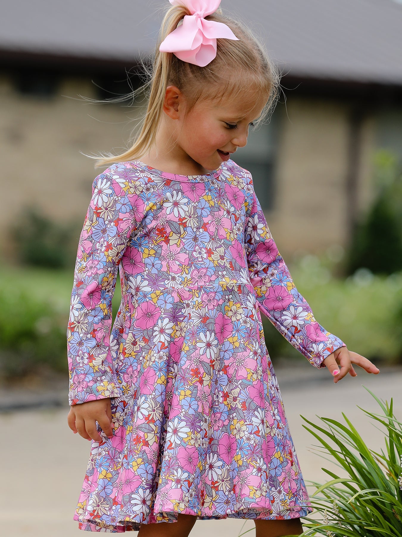 Girls long sleeve twirl dress with retro-inspired floral pattern