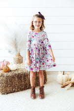 Midnight Rain 3/4 sleeve twirl dress with a full skirt, pockets, and a ballet neckline