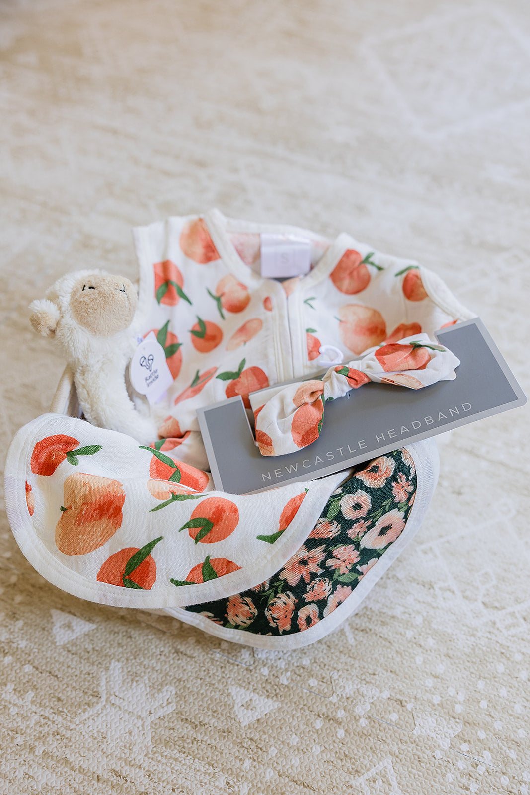 Welcome Baby Girl Peaches and Lamb Gift Basket with Sleep Sack Headband Bib and Rattle Newcastle Classics