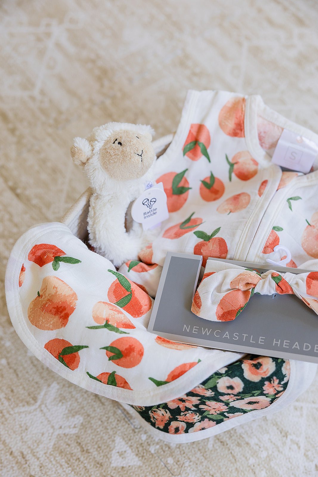 Welcome Baby Girl Peaches and Lamb Gift Basket with Sleep Sack Headband Bib and Rattle Newcastle Classics