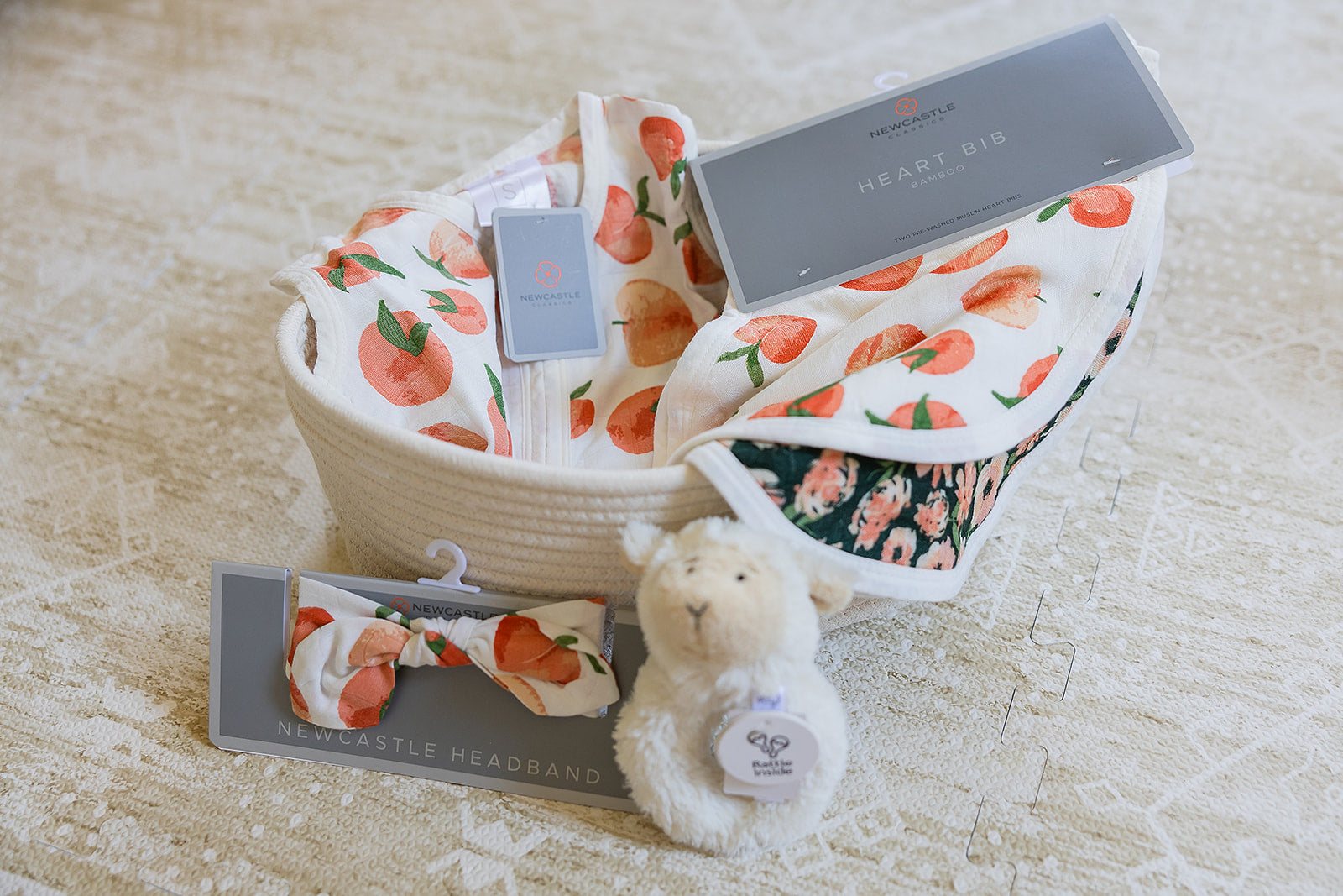 Welcome Baby Girl Peaches and Lamb Gift Basket with Sleep Sack Headband Bib and Rattle Newcastle Classics