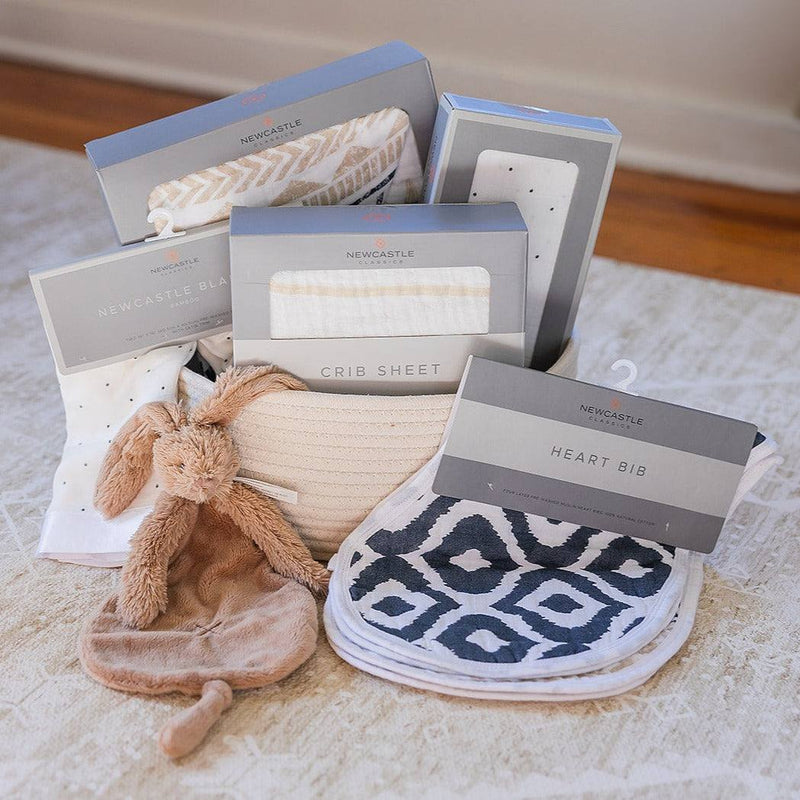 Welcome Baby basket with cotton blanket, bamboo swaddle set, crib sheet, bib set, Rabbit Richie, in a cotton rope basket.
