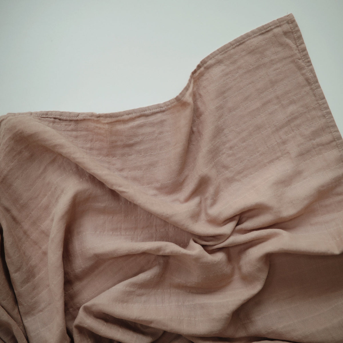 Mushie organic cotton muslin swaddle blanket