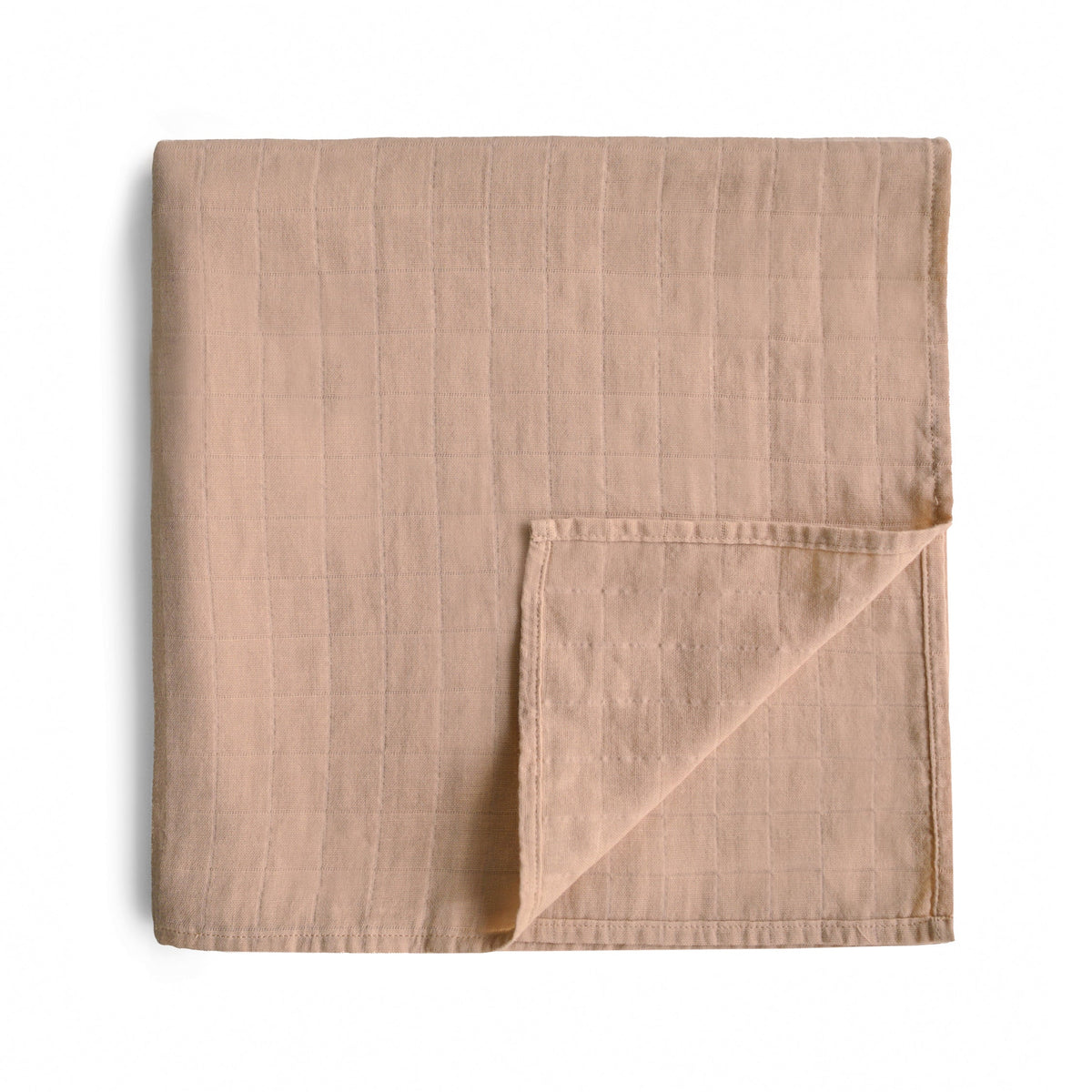 Soft, breathable Mushie organic cotton muslin baby swaddle blanket.