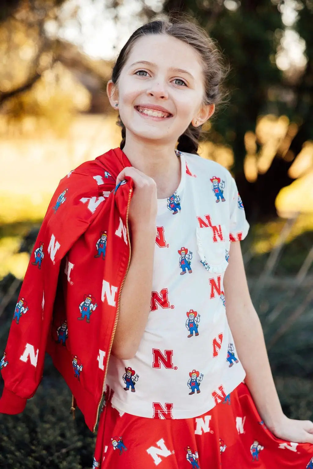 Nebraska White Herbie Husker Ruffle Pocket Tee Mila & Rose ® 