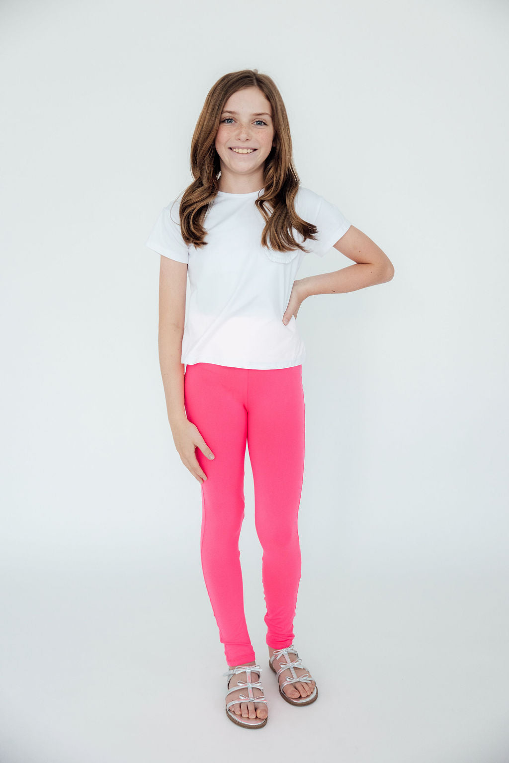 Mila & Rose vibrant neon pink organic baby leggings.