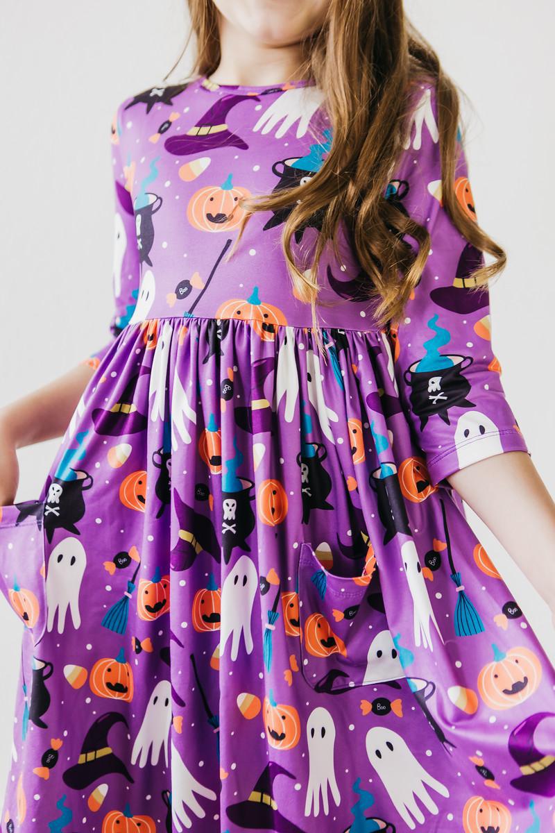 Twirl dress with 3/4 sleeves, a front pocket and "No Tricks, Just Treats" Halloween print