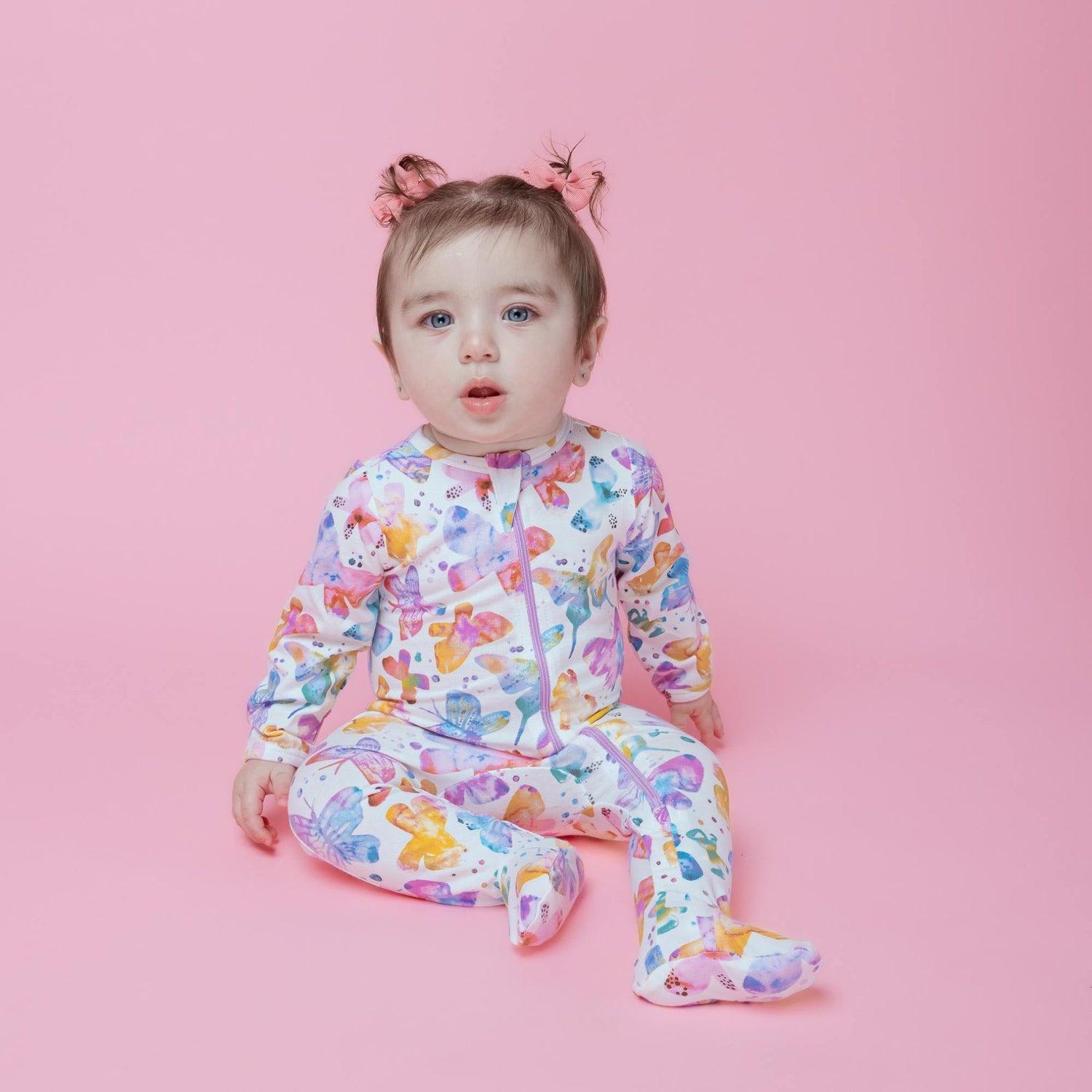 Norani Baby organic newborn footed onesie with contrast zipper.