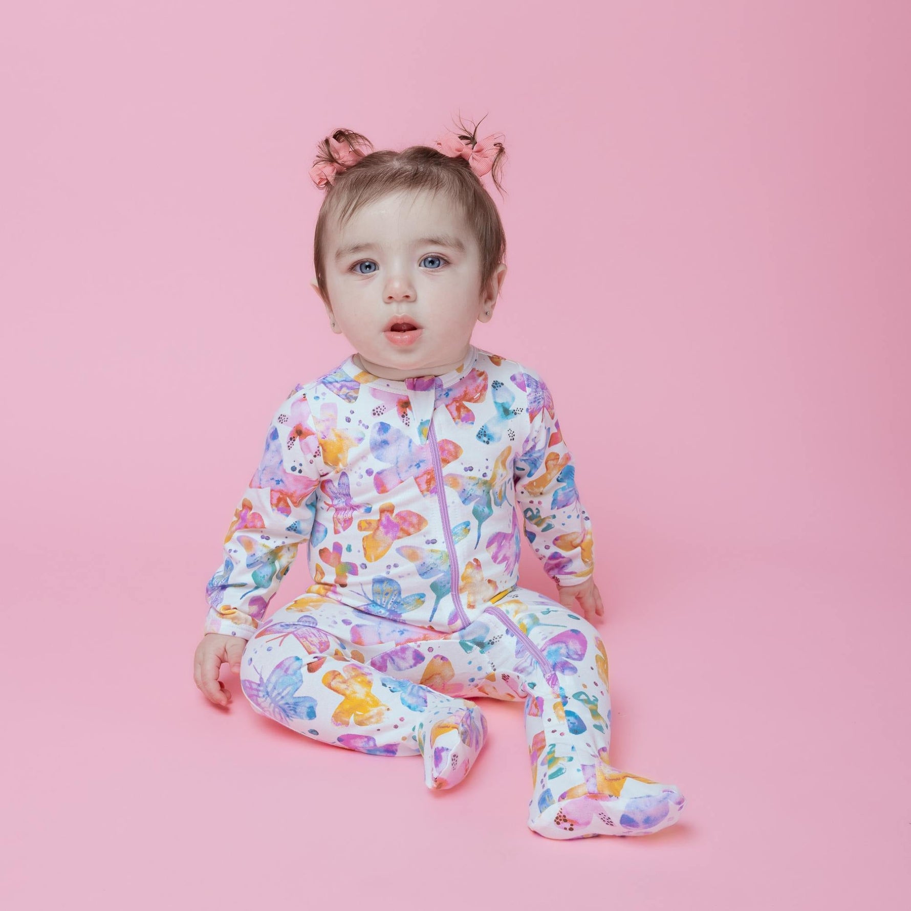 Norani Baby organic newborn footed onesie with contrast zipper.