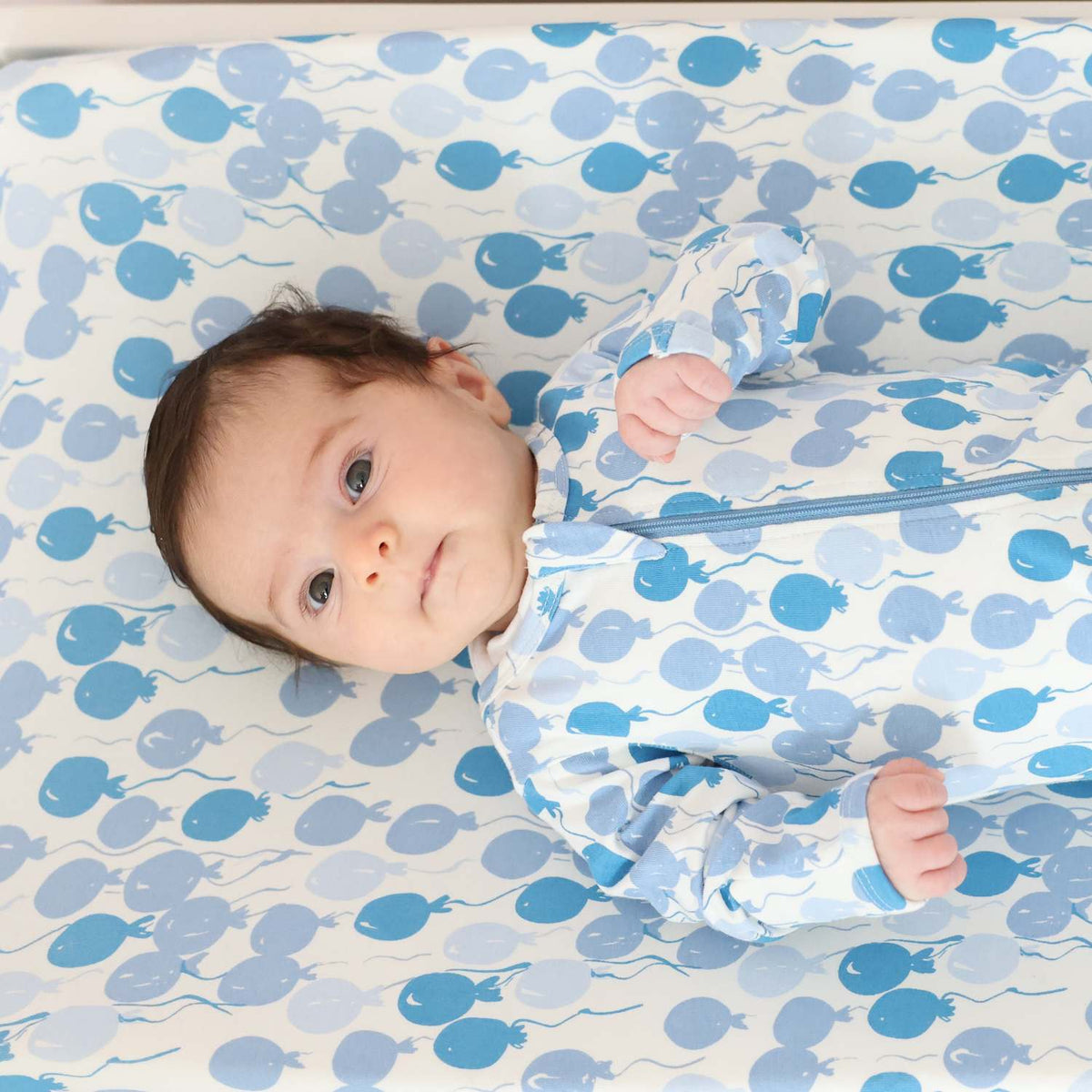 Norani Baby organic footie, blue balloons print, soft baby sleepwear.