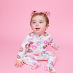Norani Baby organic baby footie sleeper with a sweet donut pattern.