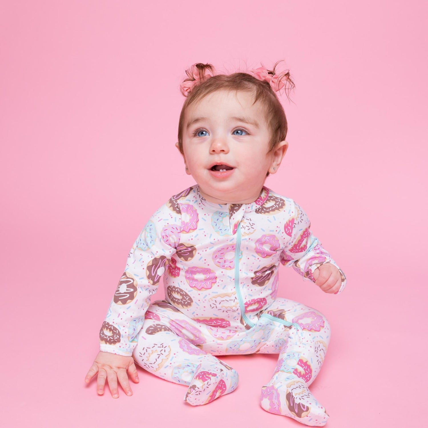 Norani Baby organic baby footie sleeper with a sweet donut pattern.