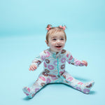Norani Baby organic baby footie pajamas with colorful donut print.