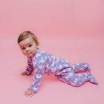 Norani Baby organic footed onesie for newborns with contrast zipper.