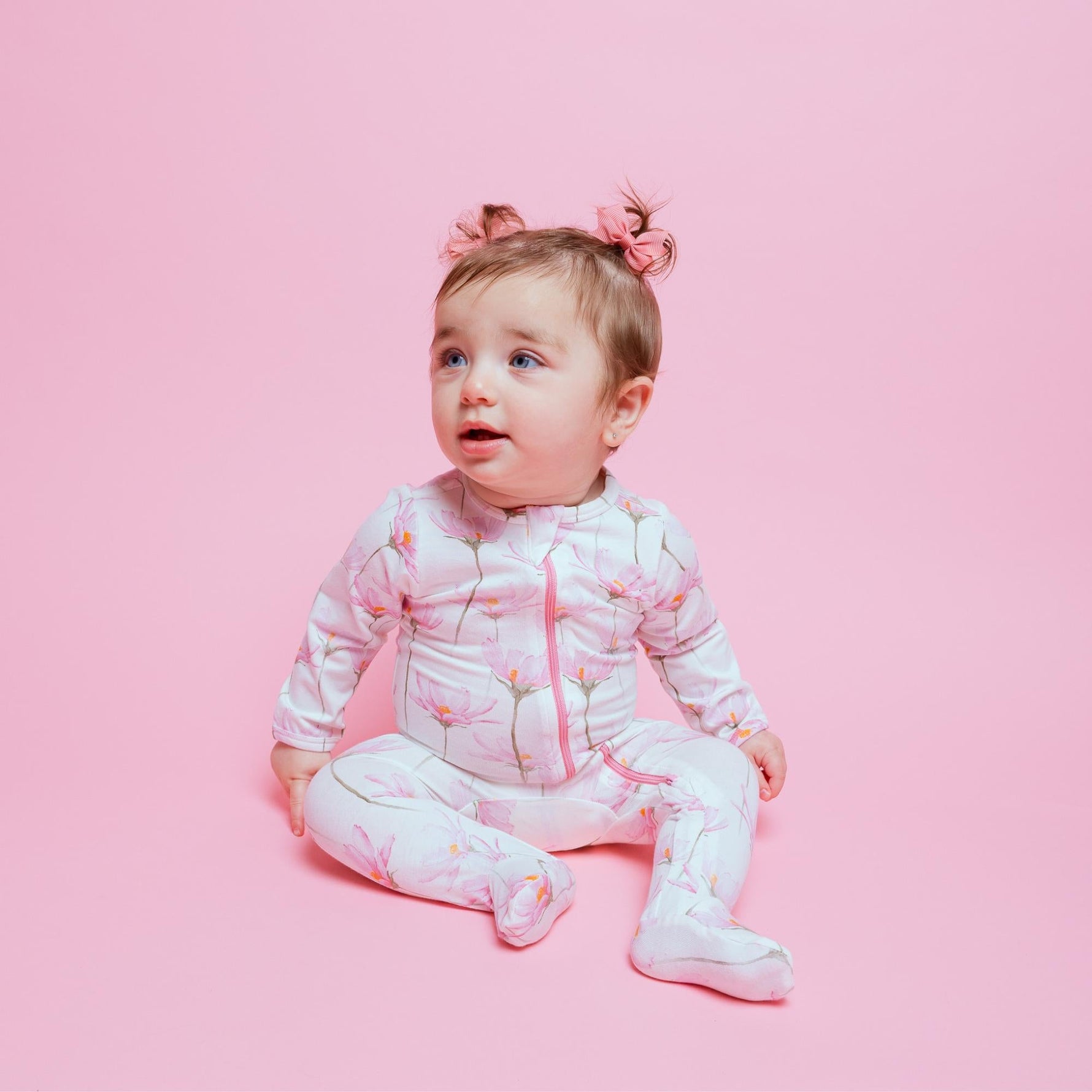 Soft Norani Baby organic footie with contrast zipper for newborns.