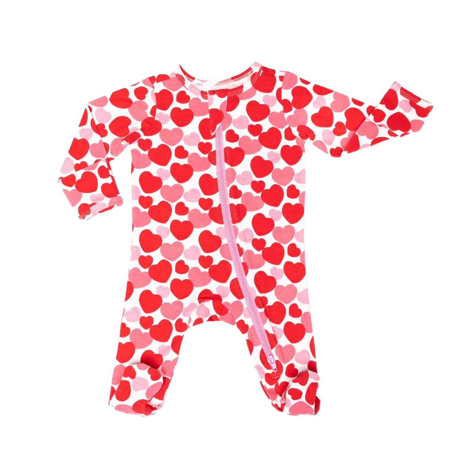 Norani Baby organic footie pajamas with red and pink hearts.