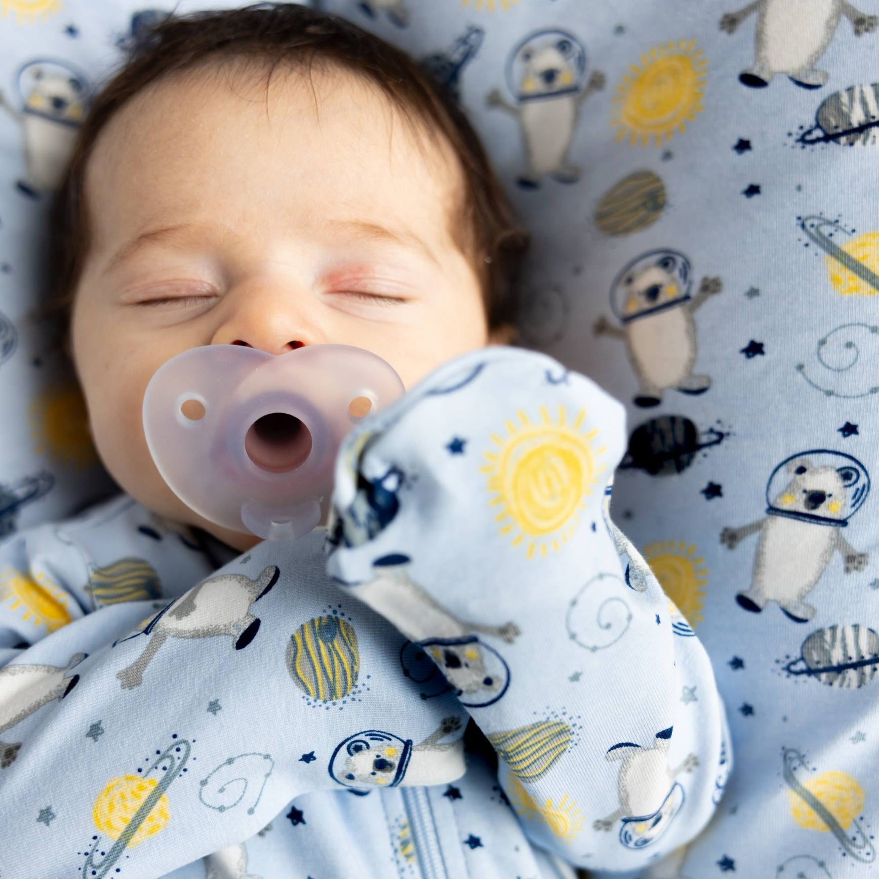 Norani Baby organic footie pajamas with space bears print.