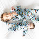 Norani Baby organic footie pajamas with colorful car print.