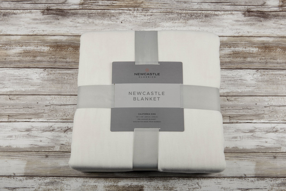 Soft Newcastle Classics pristine white oversized queen bamboo bed blanket.