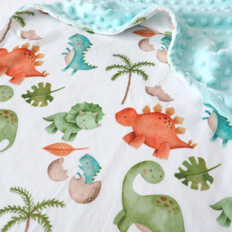 Premium baby and toddler minky blanket with dinosaur pattern and minky dot texture.