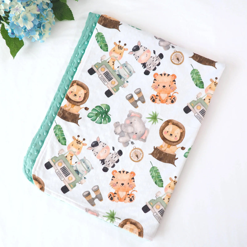 Premium baby and toddler minky blanket with safari pattern, soft and lightweight with green minky dot texture.